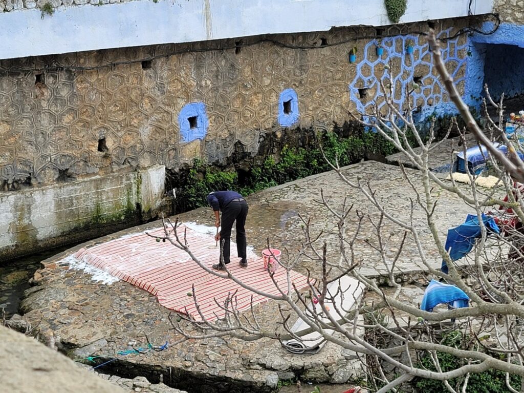 Cleaning the traditional red and white blankets